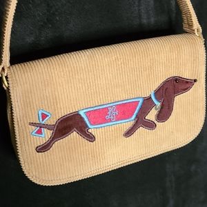 A corduroy Lulu Guinness dachshund design purse